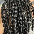 Close-up of faceted teardrop shaped black agate loose beads for DIY jewelry making - Black Agate