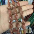 Macro view of faceted teardrop goldstone beads with copper sparkles for DIY jewelry - Gold Sandstone