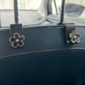 Universal car seat back hook with cute black flower design, durable auto interior accessory for bags. - Style 9