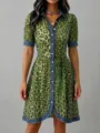Detail view of the green leopard print dress featuring blue denim patchwork collar. - S / Green