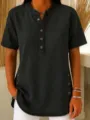 Close-up detail of dark grey denim short-sleeve shirt, button-up collar and side button vent. - S / Black