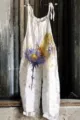 Detail view of the floral print linen jumpsuit, showing the butterfly and flower watercolor graphic. - S / Pattern 7
