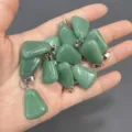 Close-up of green natural stone trapezoid pendants held in a hand - Green Aventurine / 15*20mm (Single)
