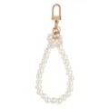 Detail view of elegant pearl wristlet keychain featuring faux pearls and gold hardware. - Style 1