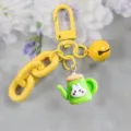 Schattige gele sleutelhanger met een dikke ketting, bel en groene theepot konijn hanger. - Stijl 1