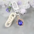 Llavero elegante de cristal azul con forma de gota, cadena blanca y dije de campana - Estilo 3
