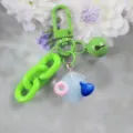 Portachiavi colorato con chiusura verde campanello catena e grazioso ciondolo. - Modello 6
