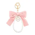 Lindo llavero de lazo rosa y perlas con anillo de metal dorado accesorio colgante de bolso. - Estilo 1 / Rosa