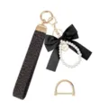Pearl keychain wristlet variant with black bow and D-ring accessories for women and girls. - Black Bow / Single Piece