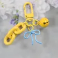 Joli porte-clés nœud couleur bonbon, grand pendentif de sac peint en alliage. - Style 1 / Jaune & Bleu