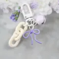 Porte-clés nœud couleur bonbon, breloque de sac chaîne grosse blanche, clochette pastel - Blanc et Violet Clair