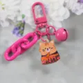 Variante portachiavi gatto carino in lega rosa con catena colorata e piccolo ciondolo campana. - modello 3 / Rosa