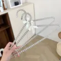 Transparante kraal kledinghangers met witte strikken, elegant ontwerp voor kledingweergave. - 40 cm transparant