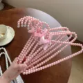 Roze parelkleerhanger met schattige strik, elegante decoratieve kledinghanger voor boetiek en thuis. - 30 cm roze