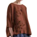 Detailed close-up view of women casual linen blouse featuring black dandelion print top. - M / Coffee