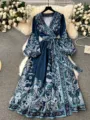 Detailed view of the women's V-neck long sleeve paisley print maxi dress with waist tie. - S / Dresses / Blue