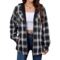 Close-up detail of women's black and white plaid fleece-lined hooded jacket fabric and zipper. - S / Tops / Black
