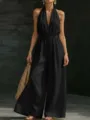 Close-up detail showing the elegant halter neck and deep V-cut of the chic black jumpsuit. - S / Set / Black