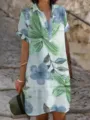 Λεπτομερής εικόνα του casual καλοκαιρινού floral print κοντομάνικου φορέματος. - Μοτίβο Μπλε Πράσινο Φυτό