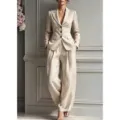 Beige tailored suit set for women featuring a single-breasted blazer and stylish wide-leg pants. - XS / Top And Bottom / Apricot