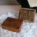 Vintage wooden stamp set with numbers symbols and weather icons in retro storage box main image - Vintage Wooden Stamp Set