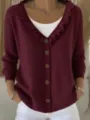 Detail shot of women's burgundy V-neck cardigan with ruffled collar and button front. - Burgundy