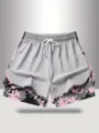 Details view of women's anti-glare sports shorts with elastic drawstring and pixel print. - Light Gray