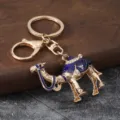 Metal alloy camel keychain bag charm with blue enamel and sparkling rhinestones for car keys. - Blue