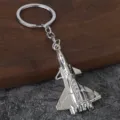 Detailed view of a creative silver metal fighter jet keychain pendant, perfect for keys and bags. - No. 3 Airplane Style (Silver) / Silver