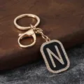 Gold metal rhinestone letter N keychain pendant accessory for car keys and bags detail view - Letter N