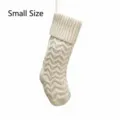Small knitted Christmas stocking detail, white wave pattern hanging decoration for holiday. - S / Ivory