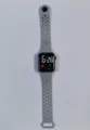 Grey LED digital smartwatch detail shot, featuring a breathable perforated silicone band. - Space Gray