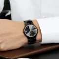 Schwarze Quarz-Uhr mit Strasssteinen und römischen Ziffern für Damen und Herren. - Wolfram Kalender Herren