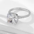 Close-up detail of a 10x10mm cushion cut cubic zirconia ring with pavé set side stones. - Size 5 / White Gold Main Ring