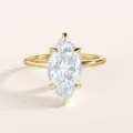 Detailed view of the exquisite marquise cut zircon ring with polished gold band sparkle. - Size 5 / Main Ring Style / Gold