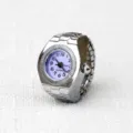 Silver tone metal stretch band ring watch with purple dial and clear quartz numbers. - Small Round Purple Dial