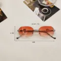 Stylish rimless gradient orange sunglasses with unique snake metal temples for women UV protection. - Pink