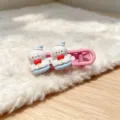Close-up detail of cute pink snowman hair clip, sweet cartoon hairpin for sweet girls style. - Pink Snowman Hair Clip