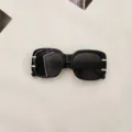 Stylish black square sunglasses with gold metal temple details for trendy street style and UV protection. - Black