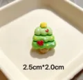 Close-up detail of a cute green resin Christmas tree brooch with star and bow decor. - Red Bow Snow Dot Tree Style 27