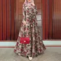 Boho floral maxi dress detail showcasing long sleeves, tiered hem and matching waist belt. - S / Milky White