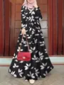 Detailed view of the women's stylish leaf printed long sleeve loose maxi dress with belt. - S / Black