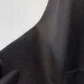 Cashmere blend double-faced wool coat fabric swatch, black water ripple texture detail. - Black