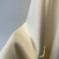 Cashmere blend zibeline fabric detail of women's long winter bathrobe coat in cream color. - White