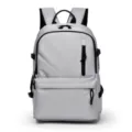 Mochila gris casual con gran capacidad y múltiples bolsillos para uso diario escolar. - Gris