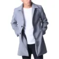 Detailed view of the men's grey wool-blend overcoat featuring a classic lapel and button closure. - M / Gray