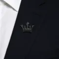 Black crown lapel pin detail view, elegant metal brooch for men suit collar decoration. - Crown / Gunmetal
