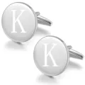 Detailed view of polished silver tone round metal engraved letter K cuff links for men shirts. - Letter K