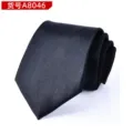Detailed view of a classic black formal business necktie, rolled neatly with smooth texture. - Black Polished