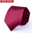Close-up detail of a classic burgundy silk-textured men's formal tie, elegant rolled design. - Glossy Burgundy